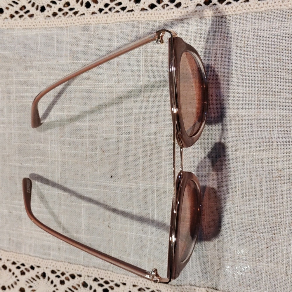 Pink guess sunglasses.